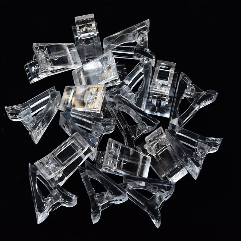 Зажим фиксирующий пластиковый (цвет: прозрачный, голубой, фиолетовый)